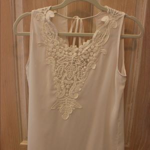 Creme sleeveless blouse